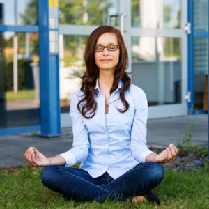 Young woman sitting meditating