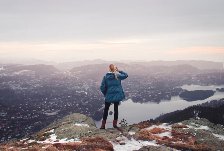 girl on top of mountain looking out