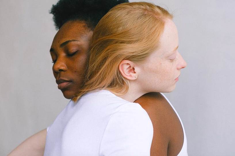 two women embrace